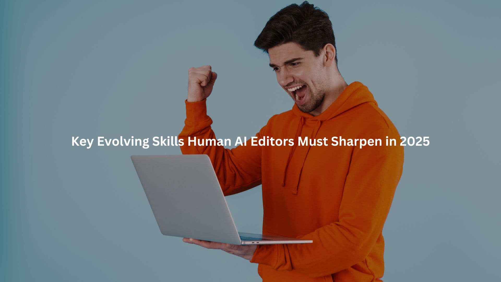 A young man in an orange hoodie is enthusiastically using a laptop, indicating a sense of energy and excitement.
